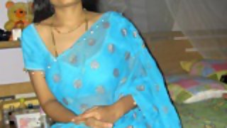 Indian wife aprita in blue saree stripping off in bedroom