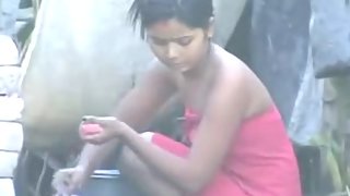 young sexy indian girl taking open air shower recorded